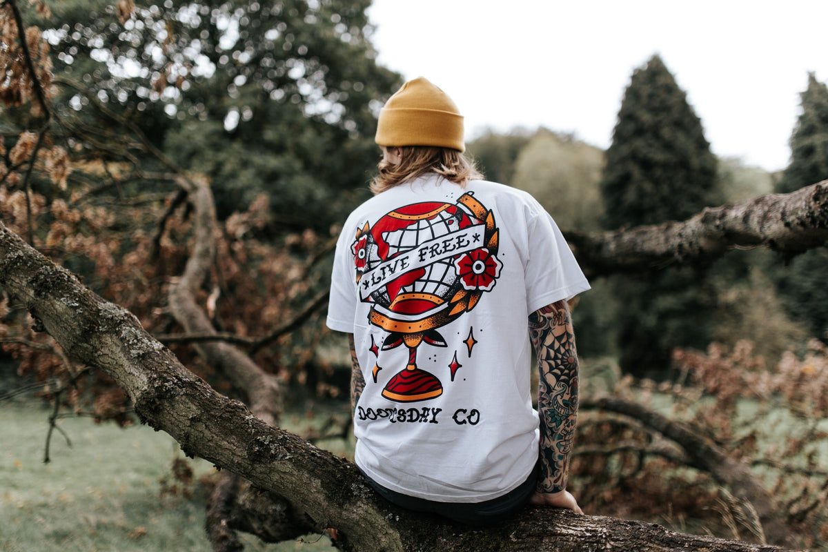 Model wearing LIVE FREE design printed onto a white T-SHIRT - doomsdayco LIVE FREE T-SHIRT back