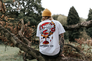 Model wearing LIVE FREE design printed onto a white T-SHIRT - doomsdayco LIVE FREE T-SHIRT back