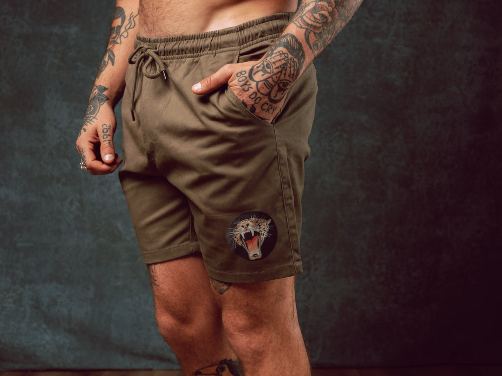 Model wearing Jaguar design printed onto khaki Walk Shorts - doomsdayco Jaguar Walk Shorts