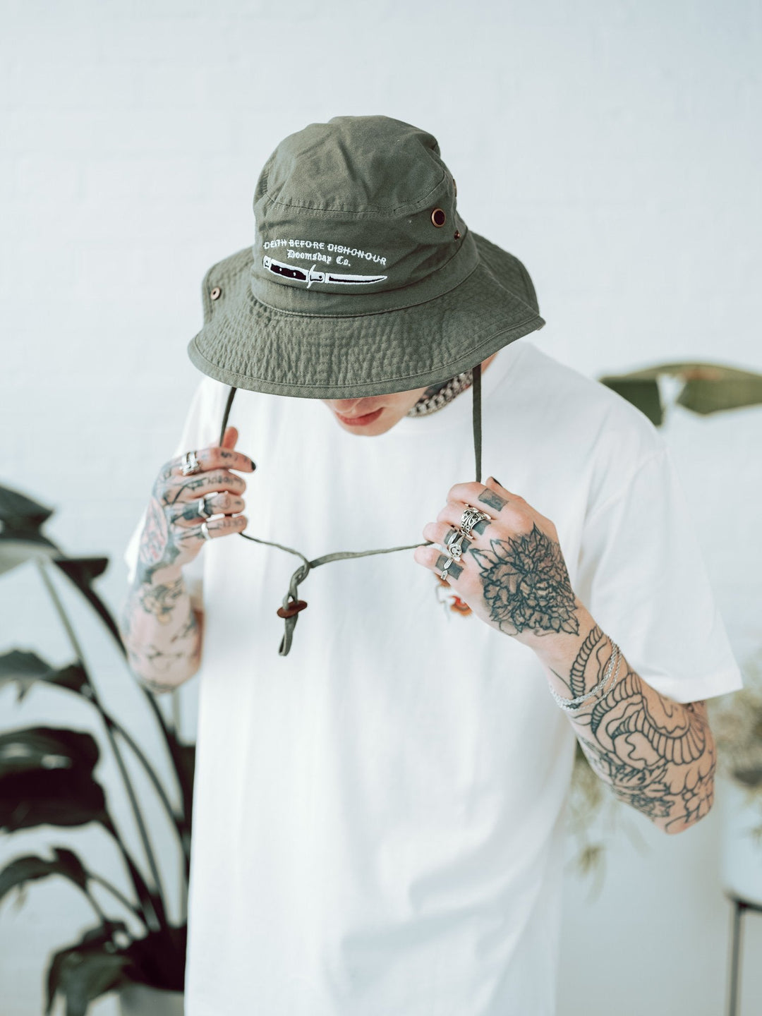 Model wearing Khaki Outback Hat with death before dishonour dagger embroidery on front - doomsdayco Khaki Outback Hat