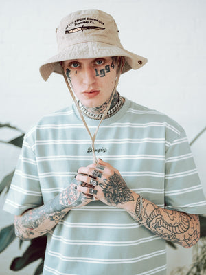 Model wearing Outback Hat with death before dishonour dagger - doomsdayco Outback Hat close up